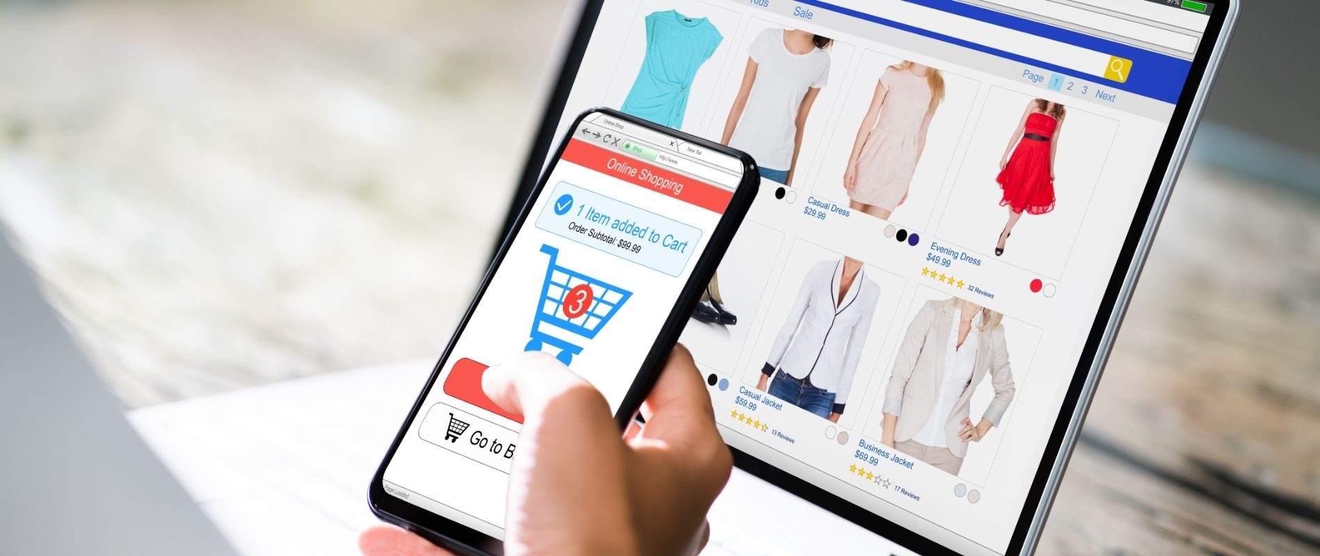 Person using smartphone and tablet for online shopping, browsing clothing items and adding to cart.