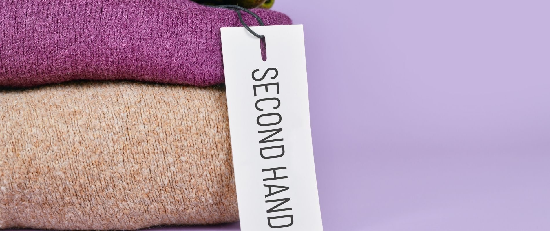 A purple background highlights folded sweaters with a tag labeled "SECOND HAND," emphasizing sustainable fashion and recycling. No people or recognizable landmarks.