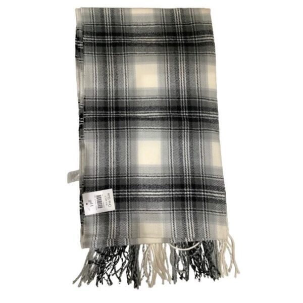 This image displays a checkered scarf with fringed edges, primarily in black, white, and gray tones. A small tag is attached to the fabric.