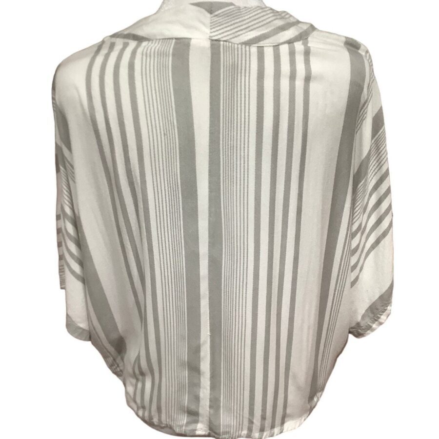 A white and grey striped poncho-style garment is displayed, showing the back view with varying vertical and horizontal stripes.