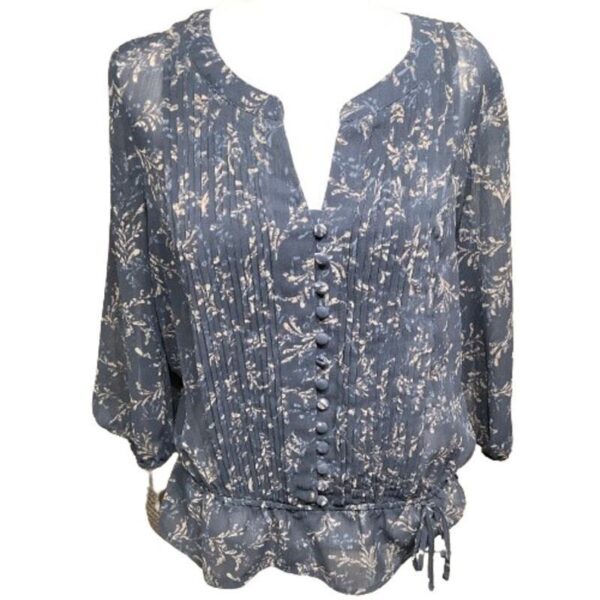 A blue floral blouse with button detailing down the front, featuring a drawstring waist and three-quarter sleeves.