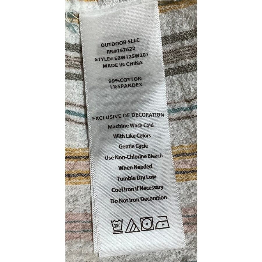 This image shows a clothing label with washing instructions and fabric content details. The garment is 99% cotton and 1% spandex, made in China.