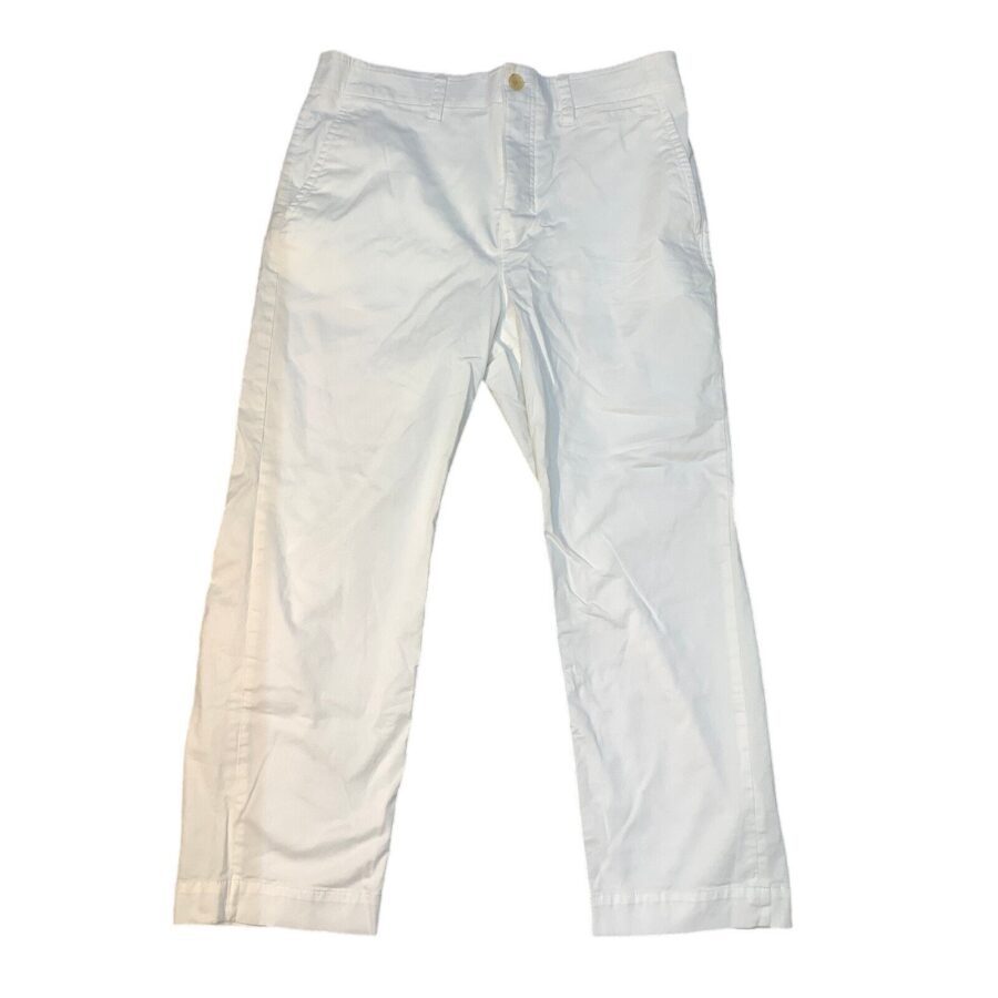 The image shows a pair of plain white pants. They have a button closure and slightly wrinkled fabric, laid flat against a white background.