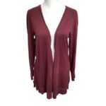 A maroon open-front cardigan displayed on a mannequin. The cardigan has long sleeves and a simple design with no visible closures or embellishments.