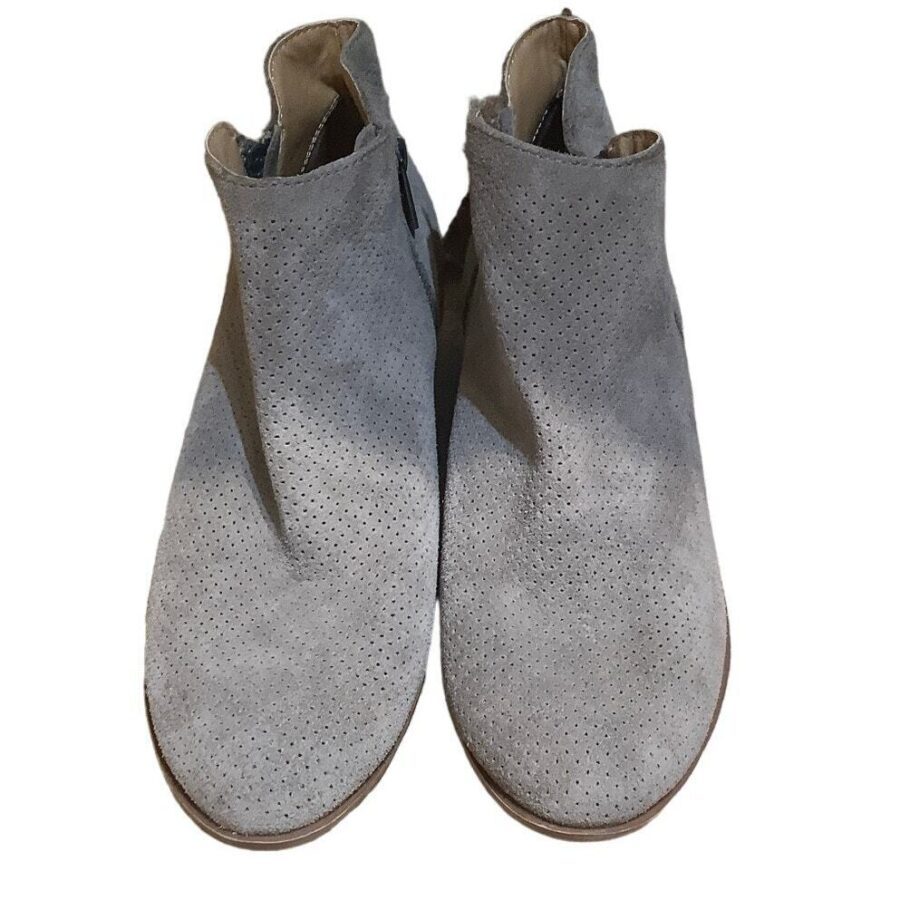 A pair of gray, suede perforated ankle boots with a minimalist design, viewed from above against a plain white background.