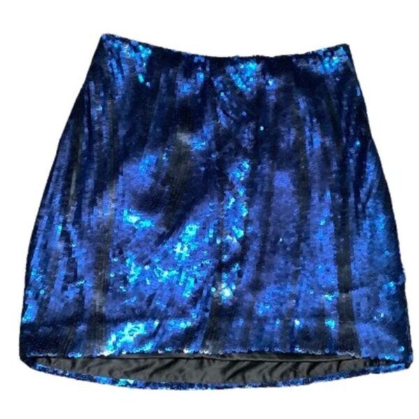 A shimmering, blue sequined skirt, photographed against a white background, showcases a vibrant and eye-catching design, perfect for festive occasions.