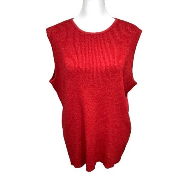 Red sleeveless knit sweater displayed on a mannequin against a white background. The simple design emphasizes texture and vibrant color.