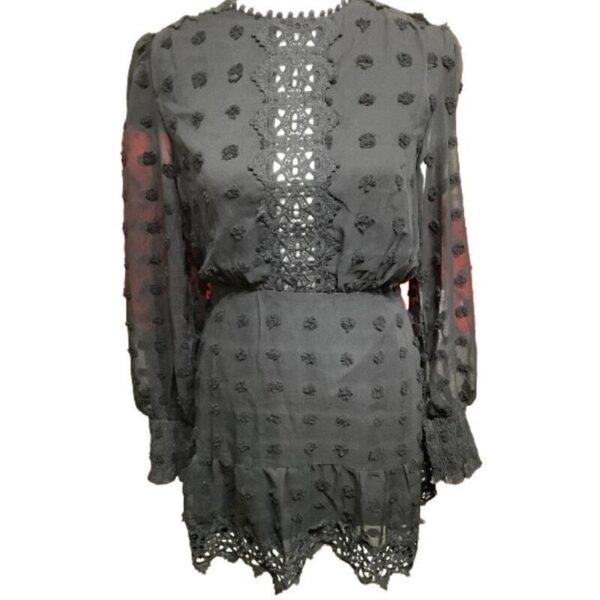 A black long-sleeve mini dress with intricate lace details and floral patterns, featuring a sheer neckline and sleeves.