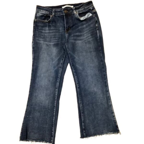 The image shows a pair of dark blue, frayed-hem denim jeans, laid flat against a plain background without any visible landmarks or historical buildings.