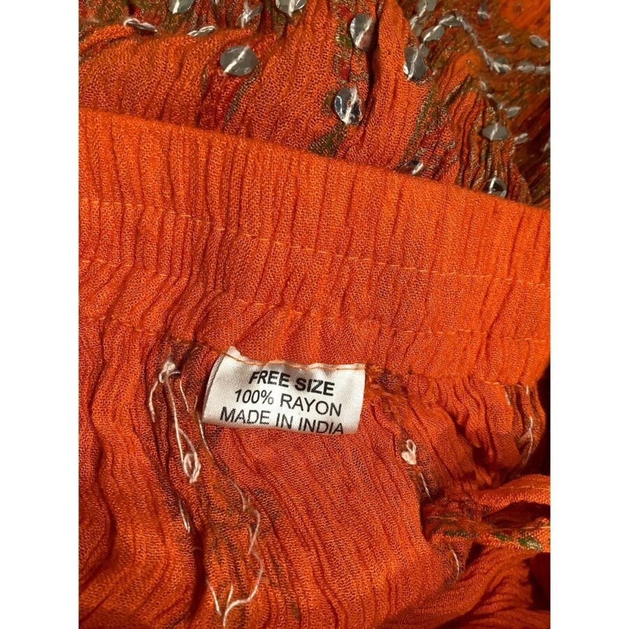 The image shows an orange fabric with a label that reads "FREE SIZE, 100% RAYON, MADE IN INDIA" attached to it.