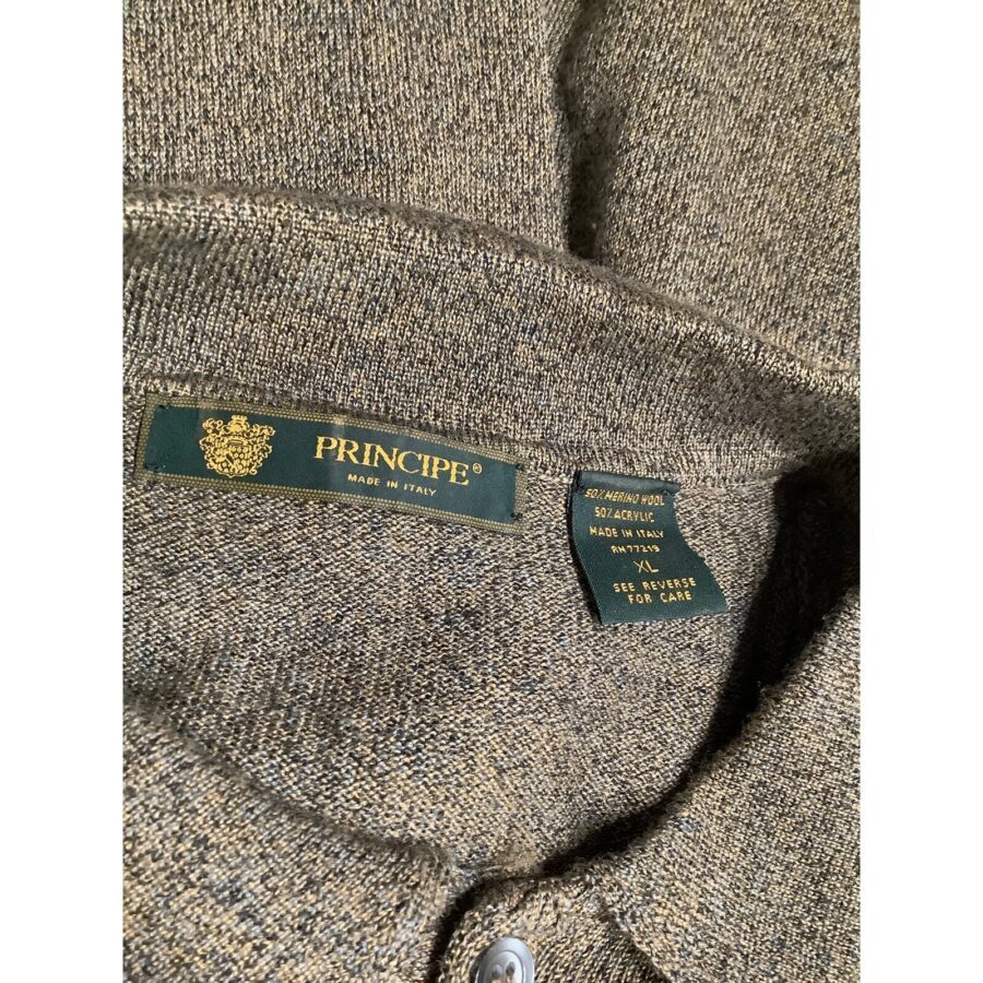 Close-up image of a brown knit sweater showing a green label with "PRINCIPE" and care instructions tag indicating it is made in Italy.