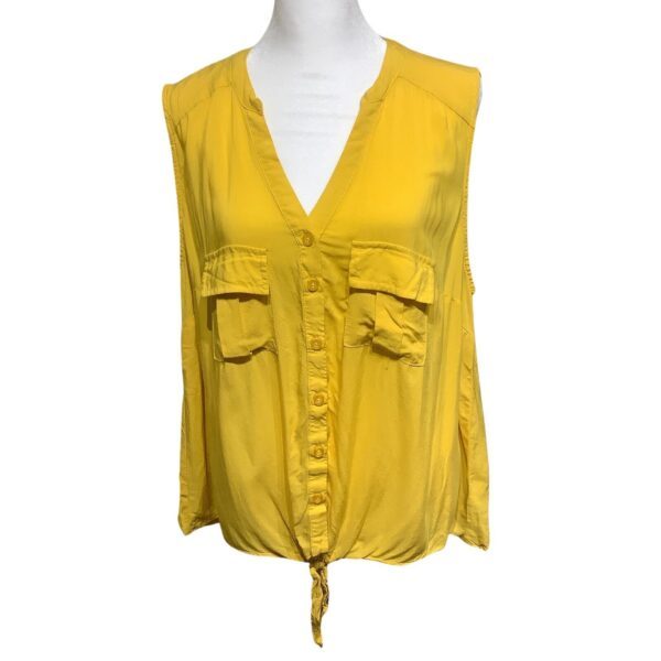 A sleeveless, yellow blouse with a V-neck, button front, and two chest pockets, displayed on a mannequin. No recognizable landmarks or historical buildings present.