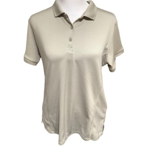 A beige short-sleeved polo shirt displayed on a mannequin, featuring a buttoned neckline and collar, photographed against a plain white background. No landmarks visible.