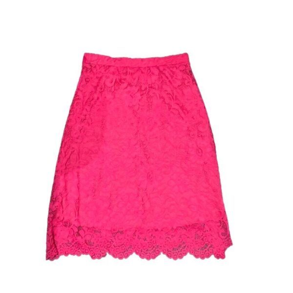 A vibrant pink lace skirt with a scalloped hem, featuring intricate floral patterns, displayed on a plain white background.