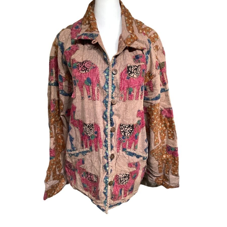 A colorful, patterned jacket featuring elephants on a stand. The design includes pink, blue, and brown hues with intricate, quilt-like stitching.