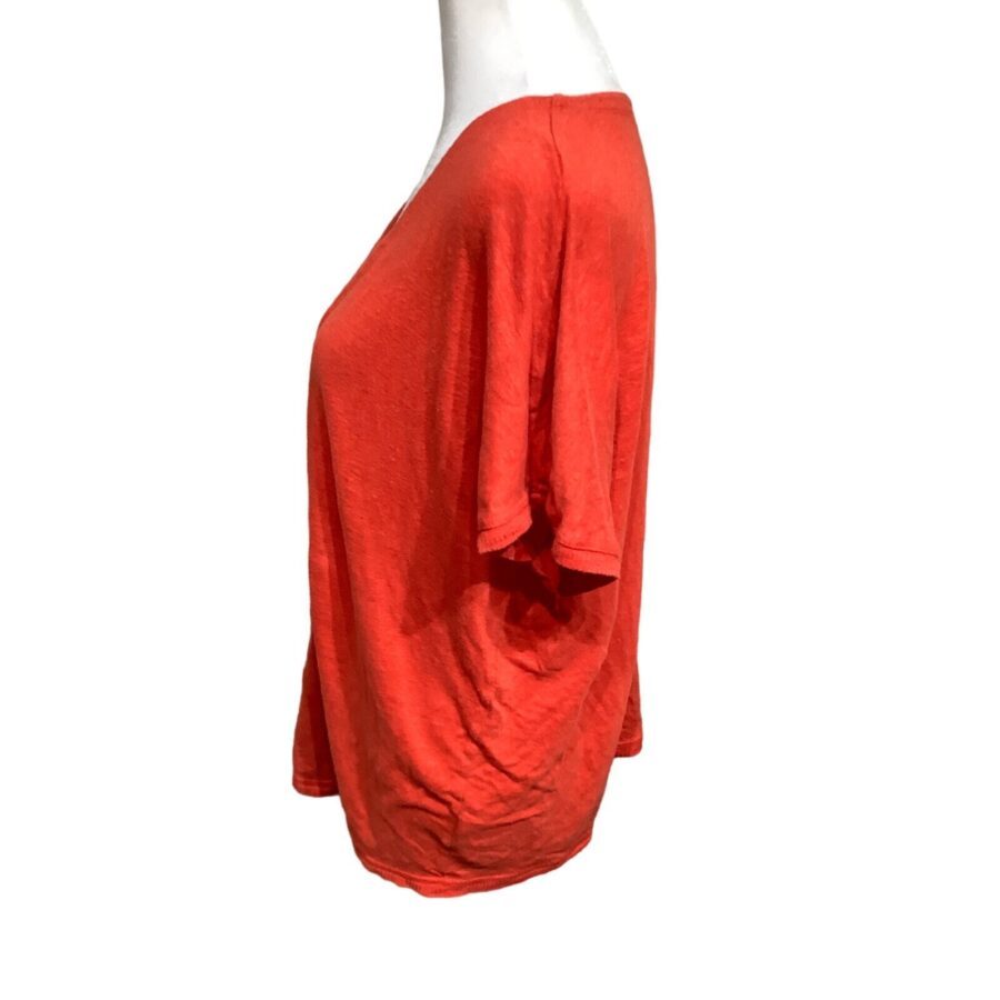 A red, short-sleeved T-shirt displayed on a mannequin. The shirt is plain, made of soft fabric, and photographed against a white background.