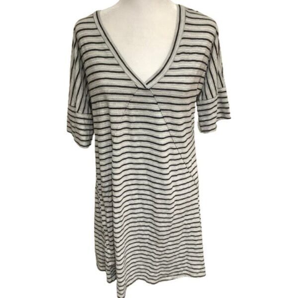 A gray and white striped short-sleeve V-neck top is displayed on a mannequin against a plain white background.