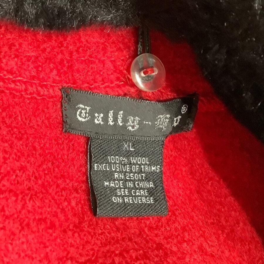 The image shows a red wool item with a black "Tally-Ho" label, indicating it is made in China and is size XL.