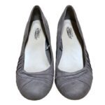 A pair of grey, suede Seychelles brand flats are displayed against a white background. The shoes have a ruched design on the toe area.