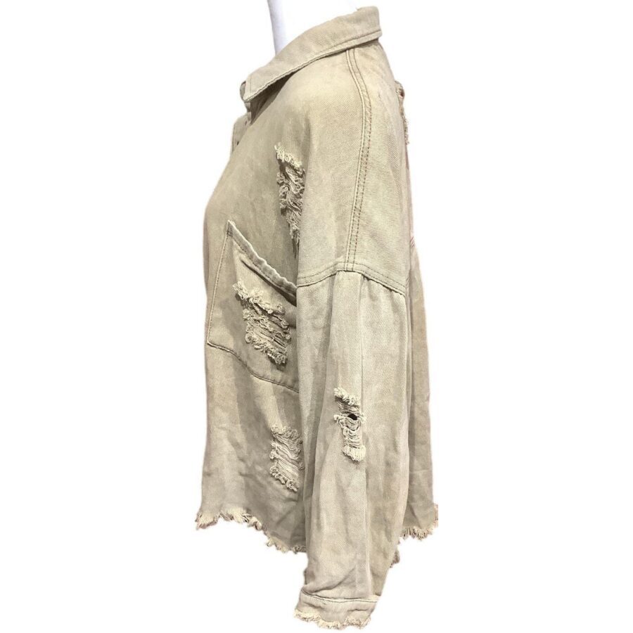 A beige, frayed, and distressed jacket is displayed on a white mannequin. The jacket features multiple ripped patches and a front pocket.