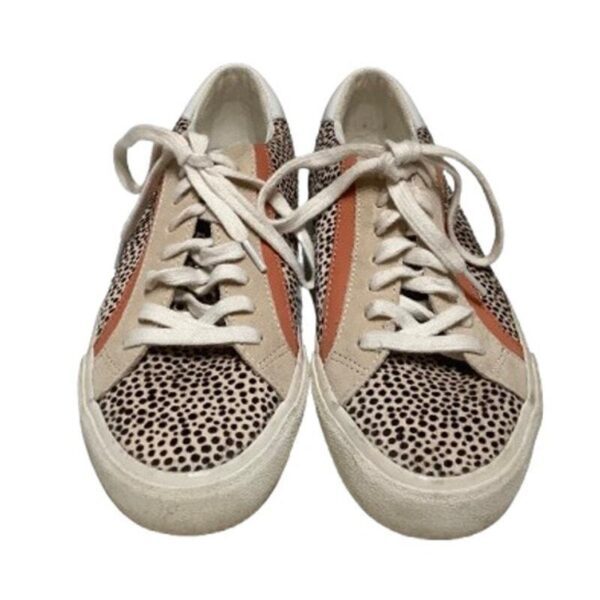 A pair of patterned sneakers featuring leopard print, beige, and orange accents, with white laces, displayed against a plain white background.