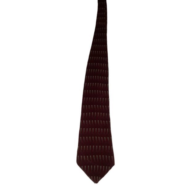 A burgundy tie with a subtle pattern, featuring small white vertical dashes, set against a plain white background.