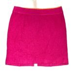 This image shows a vibrant pink skirt against a plain white background. The skirt has a simple design with a waistband and a short hemline.