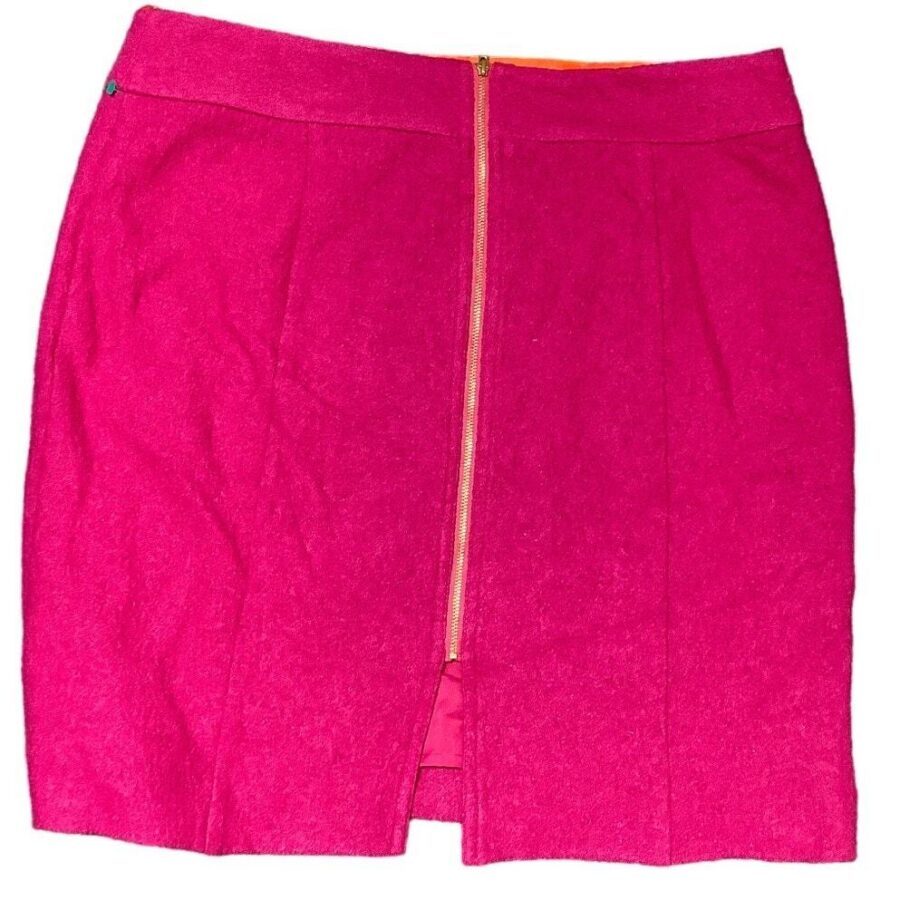 A vibrant pink skirt with a vertical center zipper and a small front slit is displayed against a plain background.