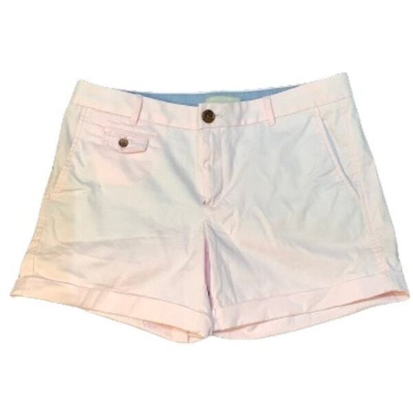 The image shows a pair of light pink, buttoned, and zippered shorts with front pockets, a small coin pocket, and folded hems.