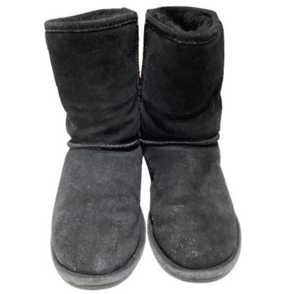 A pair of black, suede winter boots with plush lining, placed side by side against a white background.