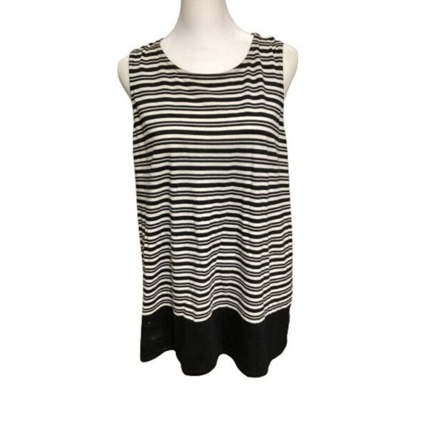 A mannequin displays a sleeveless, black-and-white striped top with a black hem. The background is plain white. No landmarks or buildings are present.