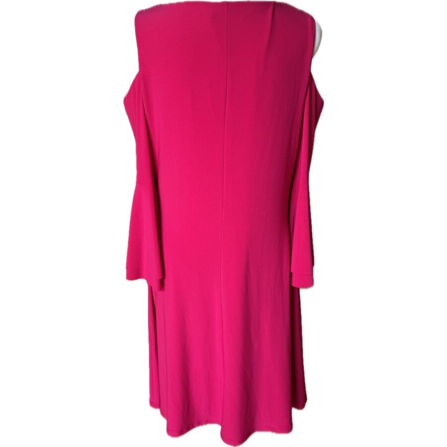 A vibrant pink dress with cold shoulder sleeves is displayed against a plain white background, showcasing its stylish and contemporary design.