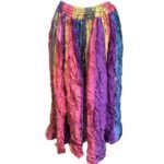 The image shows a colorful, crinkled, multi-striped skirt featuring a mix of vibrant colors like pink, purple, yellow, and blue, with an elastic waistband.