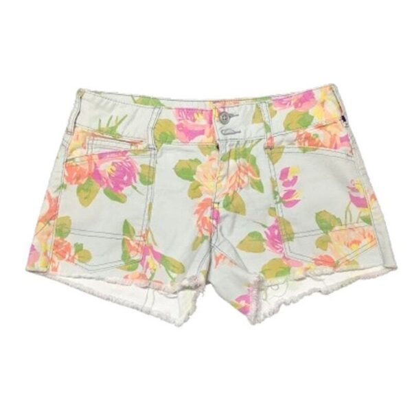 These are light-colored shorts featuring a colorful floral pattern. The shorts have front and back pockets with frayed hems for a casual look.