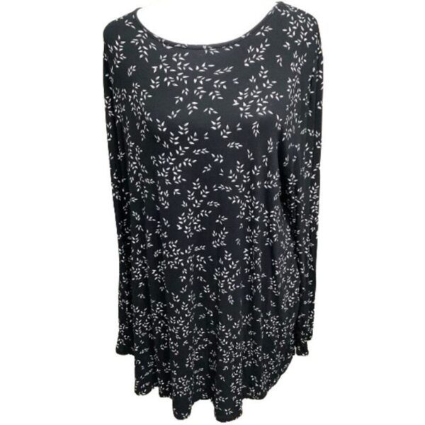 Long-sleeved black top with a white floral pattern. The top has a loose, flowing design and a round neckline, displayed against a plain white background.