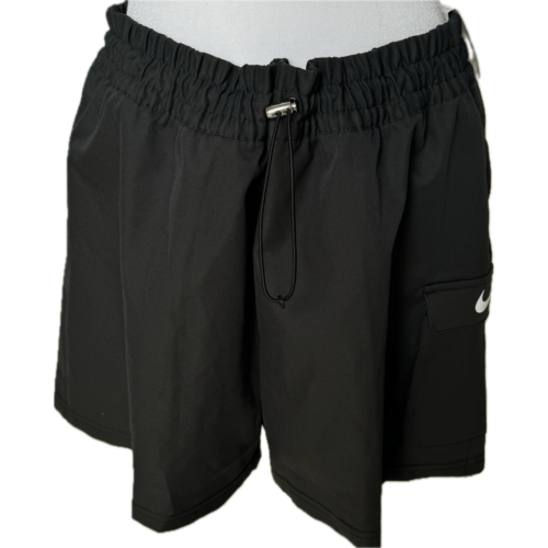 Black athletic shorts with an elastic waistband, drawstring, and pocket featuring a small Nike logo on the front. Simple and functional design.