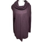 A mannequin displays a purple, long-sleeved sweater with a cowl neck. The fabric features a ribbed texture, creating subtle horizontal lines.