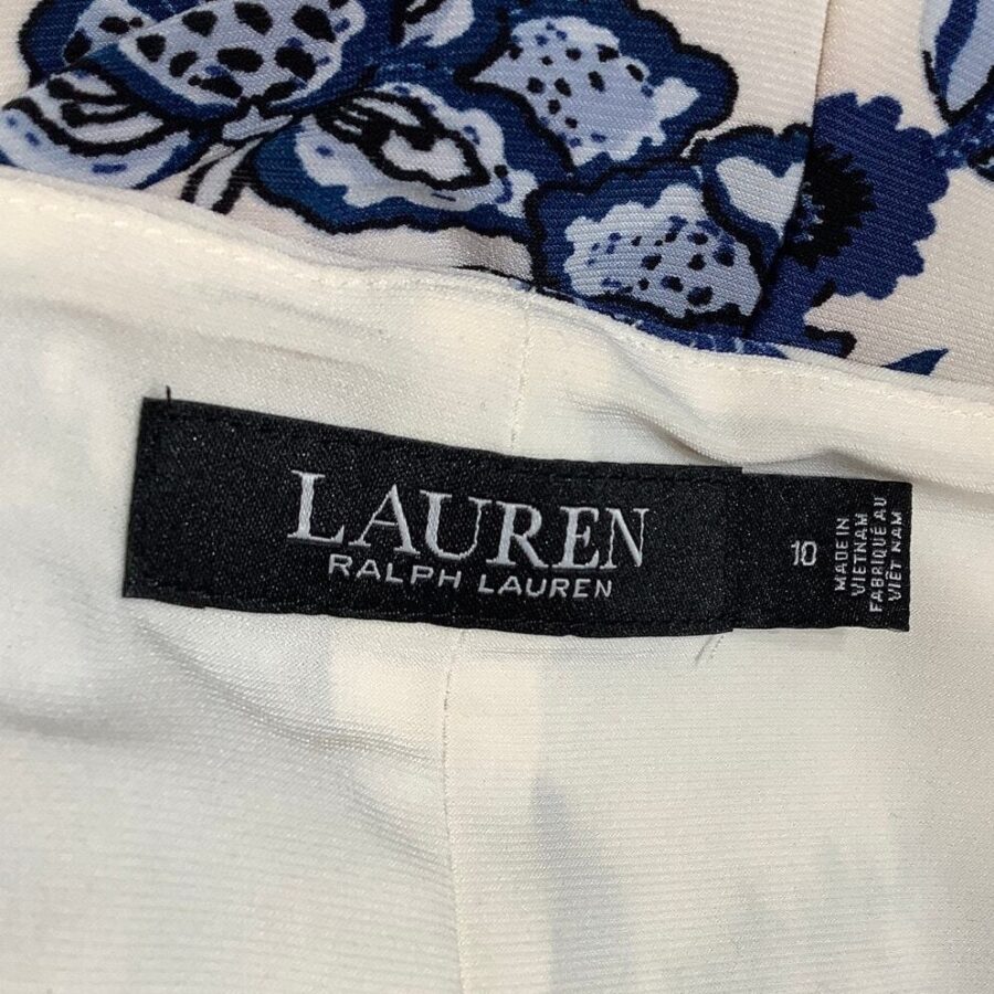 Close-up of a clothing tag labeled "Lauren Ralph Lauren" inside a garment with blue floral print fabric.