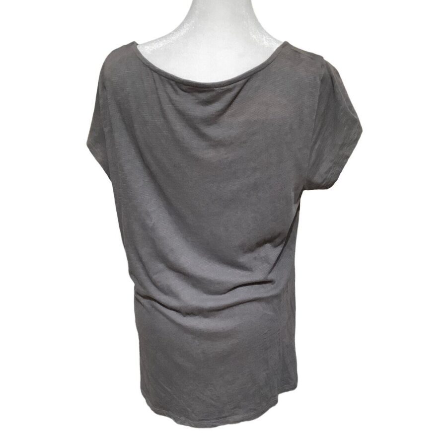 A gray T-shirt is displayed on a mannequin, showing the back view with simple, short sleeves and a slightly loose fit.