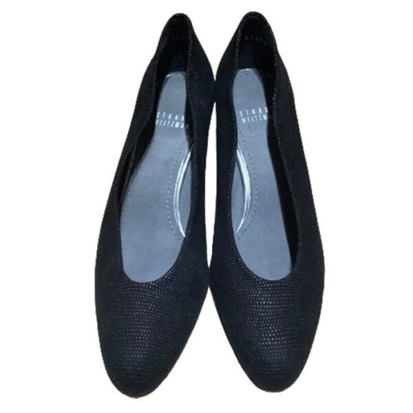 A pair of black slip-on ballet flats with a textured surface, displayed side by side on a white background.