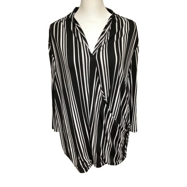 A black and white striped blouse displayed on a mannequin, featuring a draped front design with long sleeves.