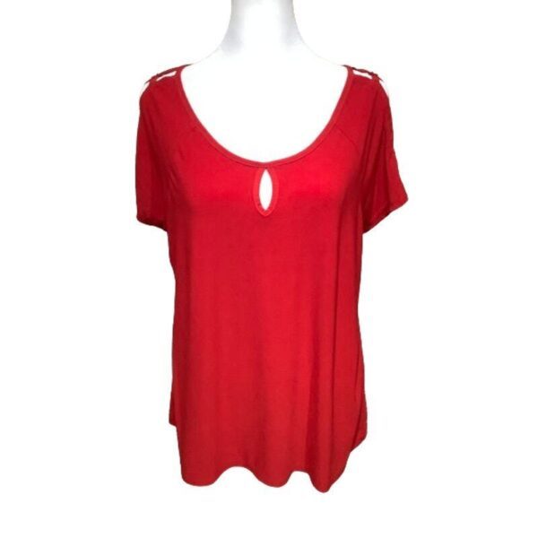 A red short-sleeved top with a keyhole neckline is displayed on a mannequin. The shoulder has a cutout pattern.