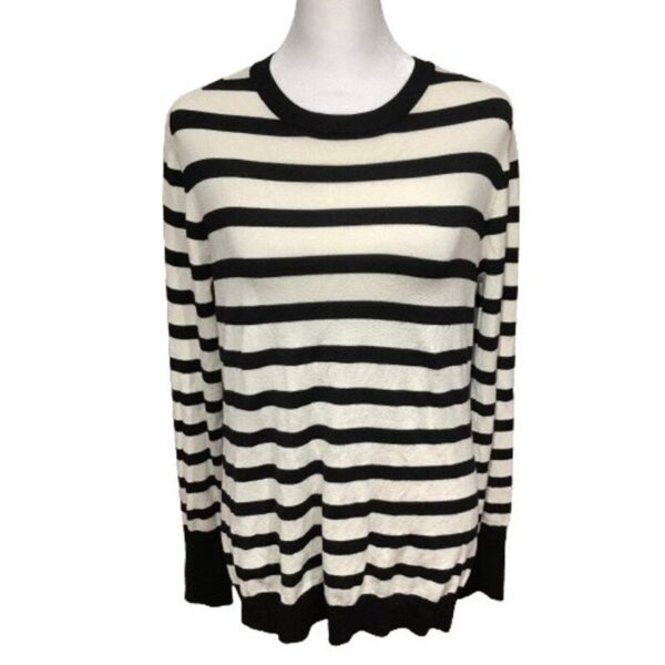 Long-sleeve black and white striped knitted sweater with a crew neckline and black cuffs, displayed on a white mannequin torso.