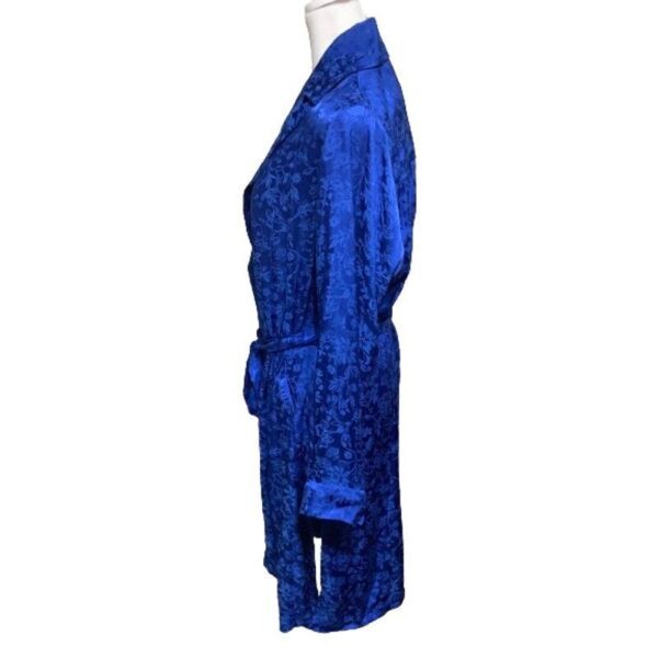 A blue satin robe with a floral pattern is displayed on a mannequin against a plain white background, showcasing its side profile.