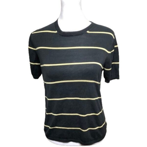 A black short-sleeved shirt with thin yellow horizontal stripes displayed on a white mannequin torso. No background or landmarks are visible.