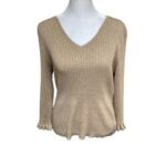 A beige V-neck knitted sweater is displayed on a mannequin torso against a white background. The sweater features a textured pattern and long sleeves.